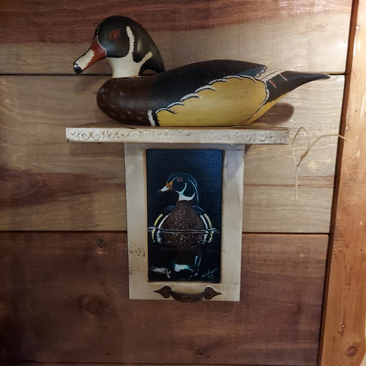 Wood duck shelf with wood duck decoy